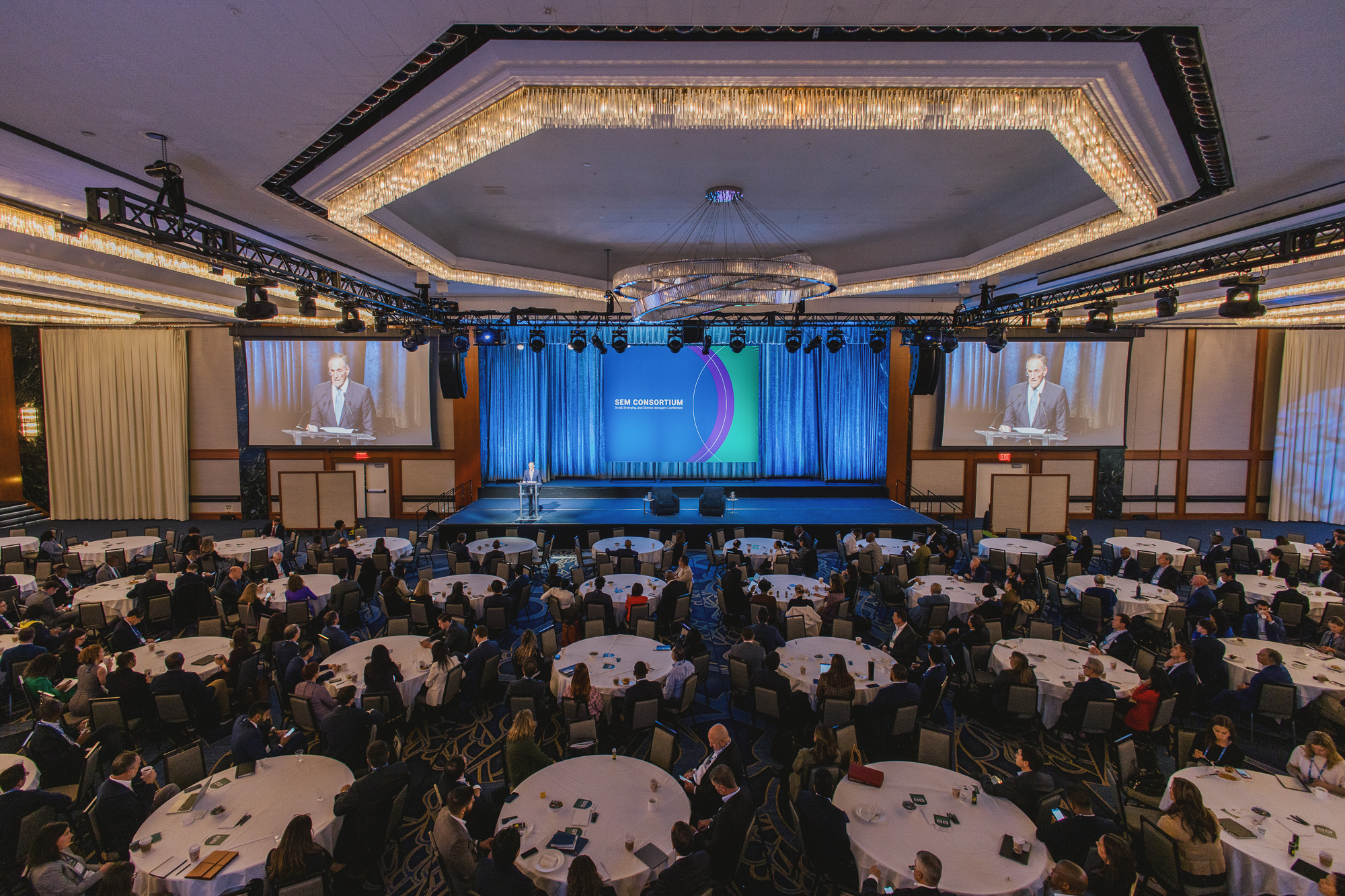 Main ballroom at SEM Consortium 2025 filled with people while Michael Sacks presents on stage