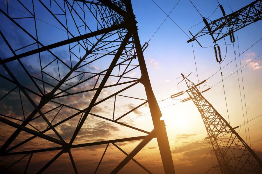 Telecom lines from below with sun setting above them