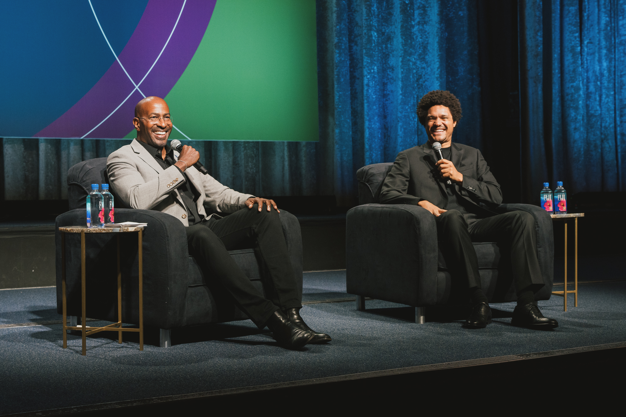 Trevor Noah and Van Jones on stage smiling at SEM Consortium 2025