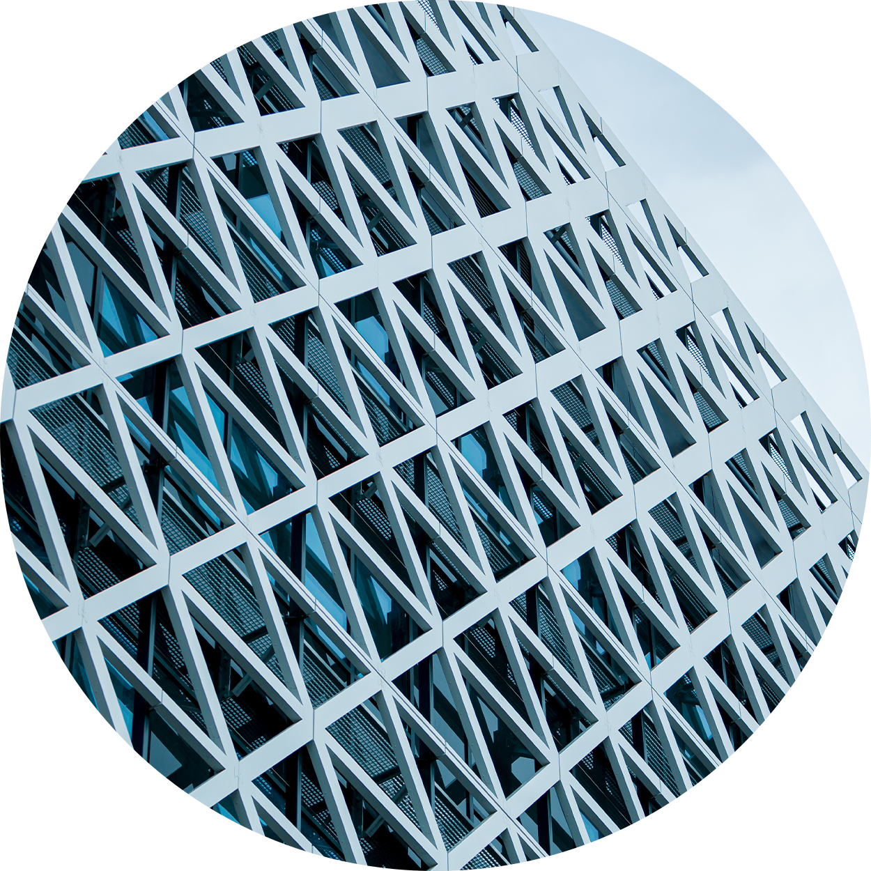 Geometric window pattern with light blue sky overhead