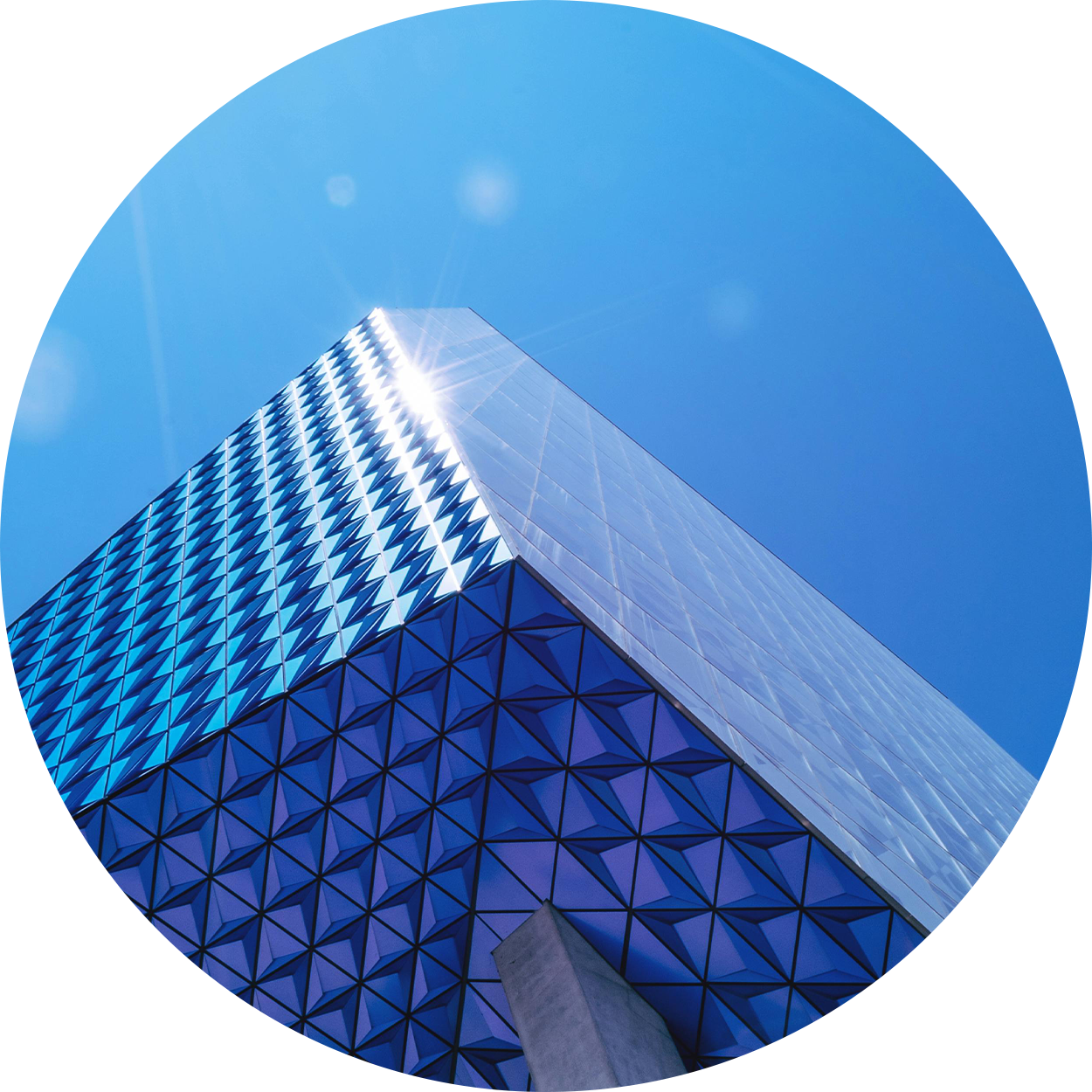 Geometric window pattern with blue sky overhead