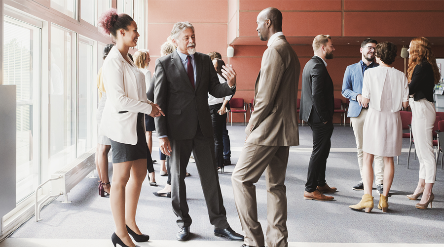 Group of diverse business men and women at conference