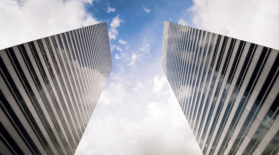 Ground view looking up at two identical city buildings